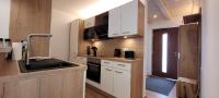 A kitchen or kitchenette at Hochalmbahnen Chalets Rauris 1-20 WE1, Maislaufeldweg 1r EG