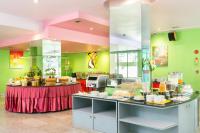 a kitchen with a table with food on it at Bella Villa Metro in Pattaya North