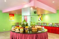 a table with a bunch of cakes on it at Bella Villa Metro in Pattaya North