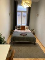 A bed or beds in a room at Dembi at the Great City Park