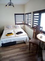 Posteľ alebo postele v izbe v ubytovaní Apartament Karamba