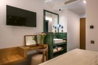 Dimargio Luxury Hotel & Spaにあるベッド