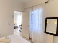Łóżko lub łóżka w pokoju w obiekcie Villa Sandra Little Haven Apartment
