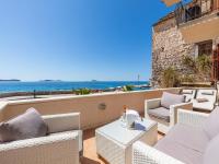 a balcony with wicker chairs and a view of the ocean at Villa Ana Apartments in Mlini