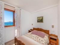 a bedroom with a bed and a window at Villa Ana Apartments in Mlini