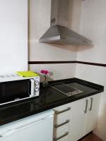Kuchyň nebo kuchyňský kout v ubytování Corrala de San Antón. Sencillo apartamento en pleno centro