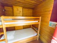 a wooden cabin with two bunk beds in it at Appartement Serre Chevalier, 1 pièce, 4 personnes - FR-1-330F-119 in Serre Chevalier