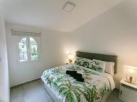 A bed or beds in a room at Casa Lumière - A little gem in Maspalomas