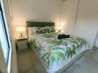 A bed or beds in a room at Casa Lumière - A little gem in Maspalomas