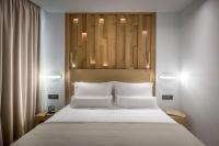 Dimargio Luxury Hotel & Spaにあるベッド