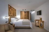 Dimargio Luxury Hotel & Spaにあるベッド