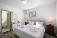 Posteľ alebo postele v izbe v ubytovaní Villa Rinia - seaview villa