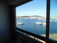 a window view of a harbor with boats in the water at Vue Mer 180° Parking+Lave-Linge+Proche Plages+Piscine in Cap d&#39;Agde