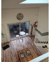 Televízia a/alebo spoločenská miestnosť v ubytovaní Maison 2 chambres, terrasse, proche de la plage N'2