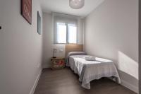 A bed or beds in a room at Apartamento Estepona I