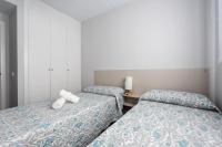 A bed or beds in a room at Apartamento Estepona I