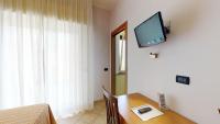 A television and/or entertainment centre at Miriam Hotel & Residence