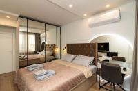 A bed or beds in a room at Gran Capital Top Central Apartment