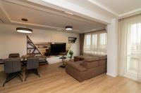 A seating area at Gran Capital Top Central Apartment