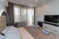 A bed or beds in a room at Gran Capital Top Central Apartment