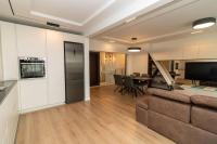 A television and/or entertainment centre at Gran Capital Top Central Apartment