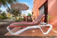 Patio lub wspólna przestrzeń na świeżym powietrzu w obiekcie Oasis Tamarindo sport e relax