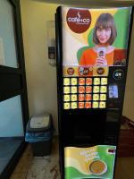 a vending machine with a picture of a woman holding a cell phone at F Hotel in Hörsching