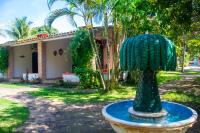 a statue of a pineapple in front of a house at Pousada São Francisco in Cumuruxatiba