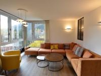 a living room with a couch and a table at Appartement Chamonix-Mont-Blanc, 4 pièces, 6 personnes - FR-1-507-62 in Chamonix