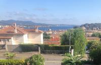 a view of a city with houses and the water at Belle vue sur mer, très près du port de Sanary in Sanary-sur-Mer