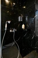 a bathroom with a shower with a hose at Apartments WS Tour Eiffel - Laos in Paris