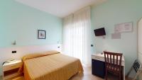 A bed or beds in a room at Miriam Hotel & Residence