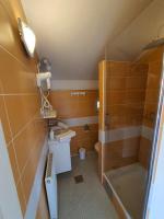 a bathroom with a shower and a sink and a toilet at So&sol boutique Hotel, Tuzla in Tuzla