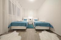 Posteľ alebo postele v izbe v ubytovaní Luxury Majpruz Suites I