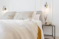 Postel nebo postele na pokoji v ubytování Suites Alfonso X