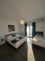 Posteľ alebo postele v izbe v ubytovaní Blue Art Apartment