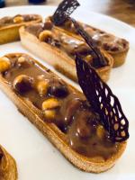 a butterfly sitting on top of a piece of bread at Maison 1643 in Laudun