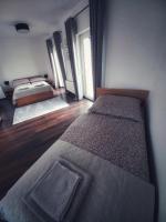 Postel nebo postele na pokoji v ubytování Komandorska Apartments