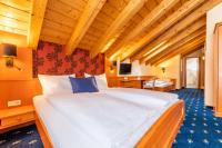 Łóżko lub łóżka w pokoju w obiekcie Hotel Tia Monte Nauders