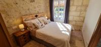 Posteľ alebo postele v izbe v ubytovaní Dom Peyreton Prestige cottages set in a charming wine property