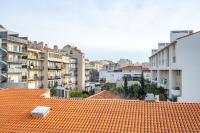 an orange tile roof with buildings in the background at Apt lumineux et très cosy avec balcon by Weekome in Marseille