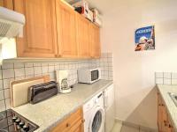 a kitchen with a washer and dryer on a counter at Appartement Morzine, 2 pièces, 6 personnes - FR-1-524-41 in Morzine