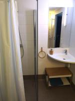 a bathroom with a shower curtain and a sink at Studio - Centre Ville - free parking in Montpellier