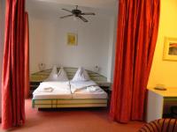 Łóżko lub łóżka w pokoju w obiekcie Hotel Familia