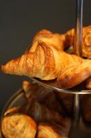 a pile of croissants on a metal tray at The Principal Madrid, Small Luxury Hotels in Madrid
