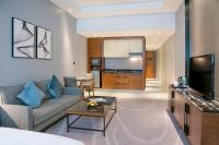 TV a/nebo společenská místnost v ubytování Asiana Grand Hotel