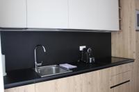 A kitchen or kitchenette at DolceAmbiez Apartments
