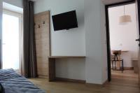 A television and/or entertainment centre at DolceAmbiez Apartments