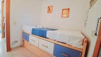 A bed or beds in a room at Apartamentos Navarra 07 Salou