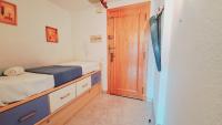 A bed or beds in a room at Apartamentos Navarra 07 Salou